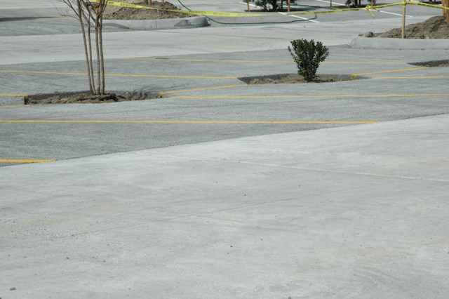Pictured: An innovative use of traditional and pervious concrete at a Williamsburg, VA shopping center parking lot.